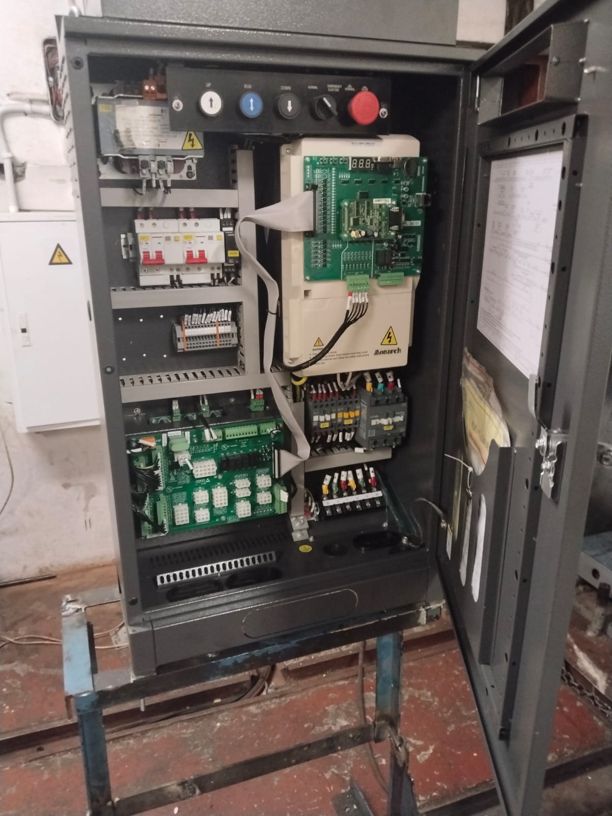 Open elevator controller cabinet with control electronics